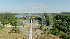 Aerial shot of bridge on Oise River with red arches