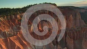 Aerial shot of bryce canyon national park tilt up from rugged red spires