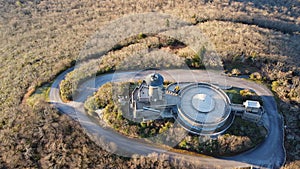 Aerial shot of a building located on a top of the Brasstown bald mountain  during the day