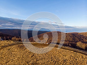 Aerial shot of the Bukk Mountains in winter, dense hilly landscape, Bukk National Park at sunrise