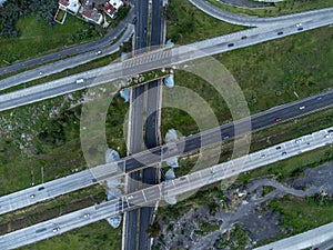 Aerial shot of a bustling city intersection with a plethora of vehicles