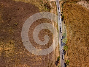 Aerial shot of car transporter trucks and trailer