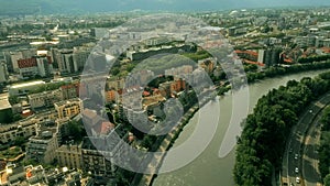 Aerial shot of the central railway terminus and Europole district in Grenoble and the Isere River, France