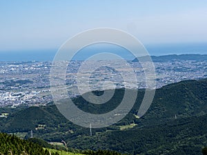 Aerial shot of Chigasaki, Hiratsuka, and Sagami Bay from the side of Mt. Oyama in Isehara, Japan photo