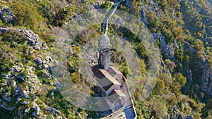 Aerial shot of the Christian church on a way to the top of the mountain where st. John's fort is located. Crkva