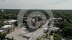 Aerial shot of Church and residential urban housing district in Naperville USA. pool. Many homes and houses.