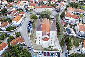 An aerial shot church of Sv. Agnes with two bell towers, Medulin Istria, Croatia