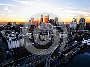 Aerial shot of the city of Minneapolis by the river Mississippi at sunset in the United States.