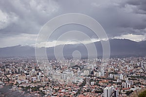 Aerial shot of a cityscape full of buildings and houses on a cloudy weather