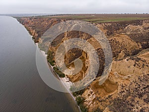 Aerial Shot of clay hills with canyons near the Black sea at Misty Autumn weather. Stanislavs mountains, Kherson region