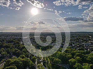 Aerial shot of the Clifton Park in New York City with the sun shining in the background