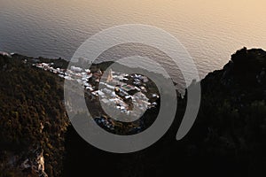 Aerial shot of the coastal village of Praiano with the church of San Gennaro during sunset