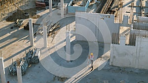 Aerial Shot of a Construction Worker Using Theodolite Surveying Optical Instrument for Measuring A