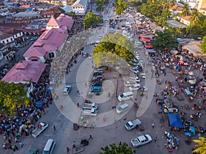 Aerial Shot of Crowded City Market in Stone Town, the Capital of Zanzibar, Tanzania. Active Trade on a Market at evening