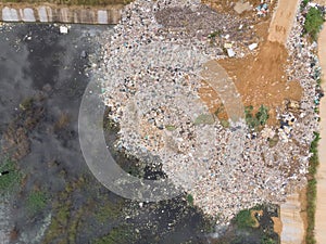 Aerial shot of drone Of plastic waste That were left piled up near the water source Causing environmental pollution problems