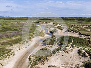 Aerial of sunset over agricultural meadowland and sea on the dutch island of Texel photo