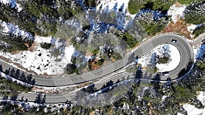 Aerial shot with drone of tight curve with cars at Gaichtpass in Tyrol