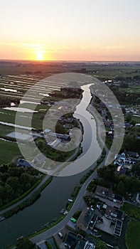 Aerial shot of the Eem River meandering through the picturesque countryside of Eemnes, Netherlands