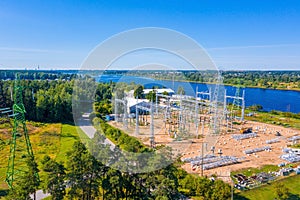 Aerial shot of electric towers powered by the Riga Hydroelectric Power Plant