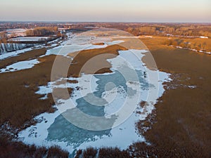 Aerial shot of the frozen lake special surface formations on a cold winter day