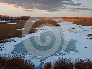 Aerial shot of the frozen lake special surface formations on a cold winter day