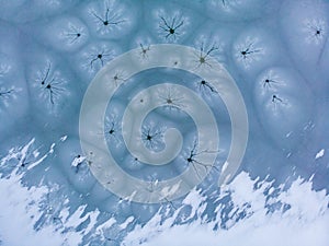 Aerial shot of the frozen lake special surface formations on a cold winter day