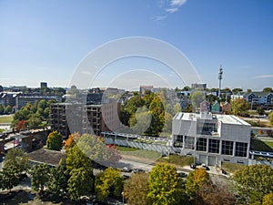 An aerial shot of a gorgeous autumn landscape in the city with skyscrapers and office buildings in the city skyline