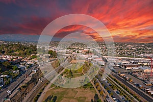 Aerial shot gorgeous autumn landscape at Los Angeles State Historic Park surrounded by streets with cars driving