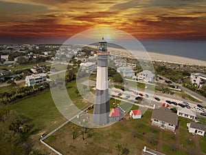aerial shot of the a gorgeous spring landscape at Tybee Island Beach with the lighthouse, blue ocean water, a brown sandy beach
