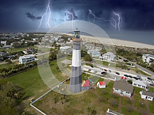 aerial shot of the a gorgeous spring landscape at Tybee Island Beach with the lighthouse, blue ocean water, a brown sandy beach