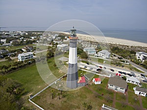 aerial shot of the a gorgeous spring landscape at Tybee Island Beach with the lighthouse, blue ocean water, a brown sandy beach