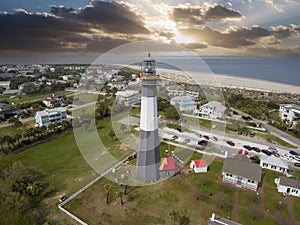 aerial shot of the a gorgeous spring landscape at Tybee Island Beach with the lighthouse, blue ocean water, a brown sandy beach