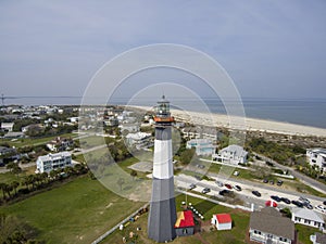 aerial shot of the a gorgeous spring landscape at Tybee Island Beach with the lighthouse, blue ocean water, a brown sandy beach