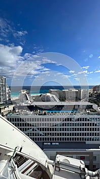 Aerial shot of a grand hotel situated beside a stunning beach in Cancun