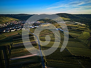 Aerial shot of green hills with vineyards near German village Weinstadt Waiblingen Stuttgart