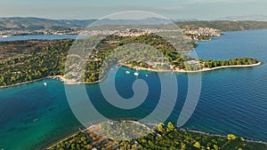 Aerial shot of green islands and turquoise sea water near Trogir, Croatia. Top travel destination, family vacation at