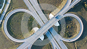 Aerial shot of highway junction with cars top view in the form of a sign of infinity