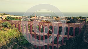 Aerial shot of historic Acueducto del Aguila or Eagle Aqueduct. Nerja, Spain photo