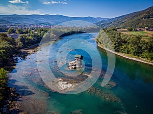Aerial shot of a house in the middle of River Drina in Perucac, Bajina Basta, Serbia photo