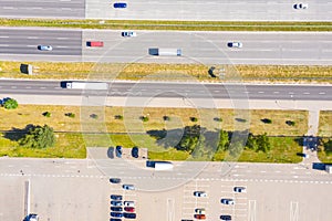 Aerial Shot of Industrial Loading Area where Many Trucks Are Unloading Merchandise