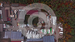 Aerial Shot of Industrial Storage Building Area where Many Trucks Are Loading Merchandise
