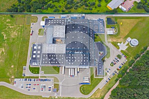 Aerial Shot of Industrial Warehouse Area where Many Trucks Are Loading Merchandise