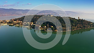 Aerial shot of Isola Maggiore island on Lago Trasimeno lake, Italy