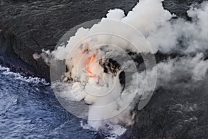 Aerial shot of KiÃâlauea lava tube entering the sea