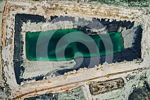 Aerial shot of the lake in Caledon, Ontario, Canada surrounded by rugged and rocky terrain photo