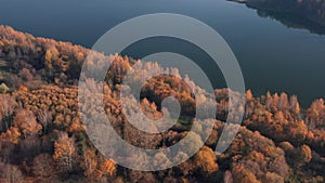 Aerial shot of late autumn forest and riverside.