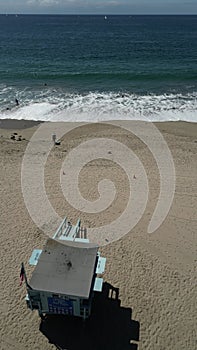 Aerial shot of a lifeguard tower at Santa Monica State Beach in California