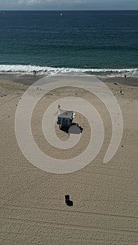 Aerial shot of a lifeguard tower at Santa Monica State Beach in California