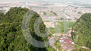 An aerial shot of a limestone hill in Ipoh
