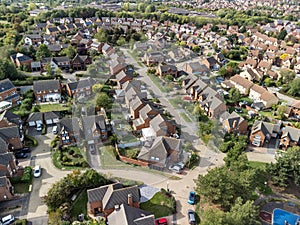 Aerial shot looking down on urban housing development - housing estate of mainly bungalows in Milton Keynes. Housing market, econo